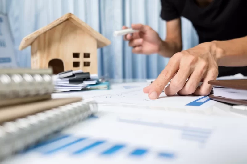 An Older Couple Shaking Hands With A Second Deed Trust Loan Broker